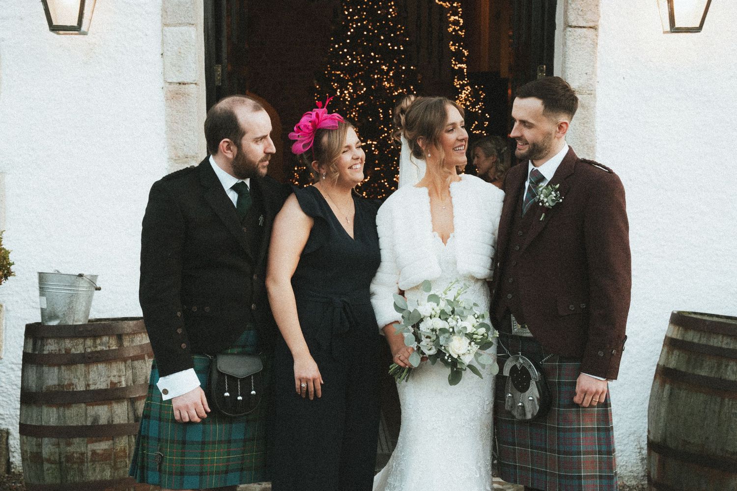 Wedding party photos showing mix of traditional Scottish and formal attire outside venue.