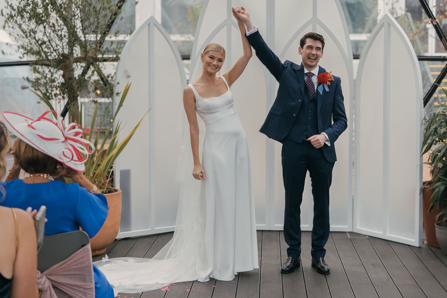 The dance floor lights up as a couple twirls gracefully during their first dance at a formal wedding reception.