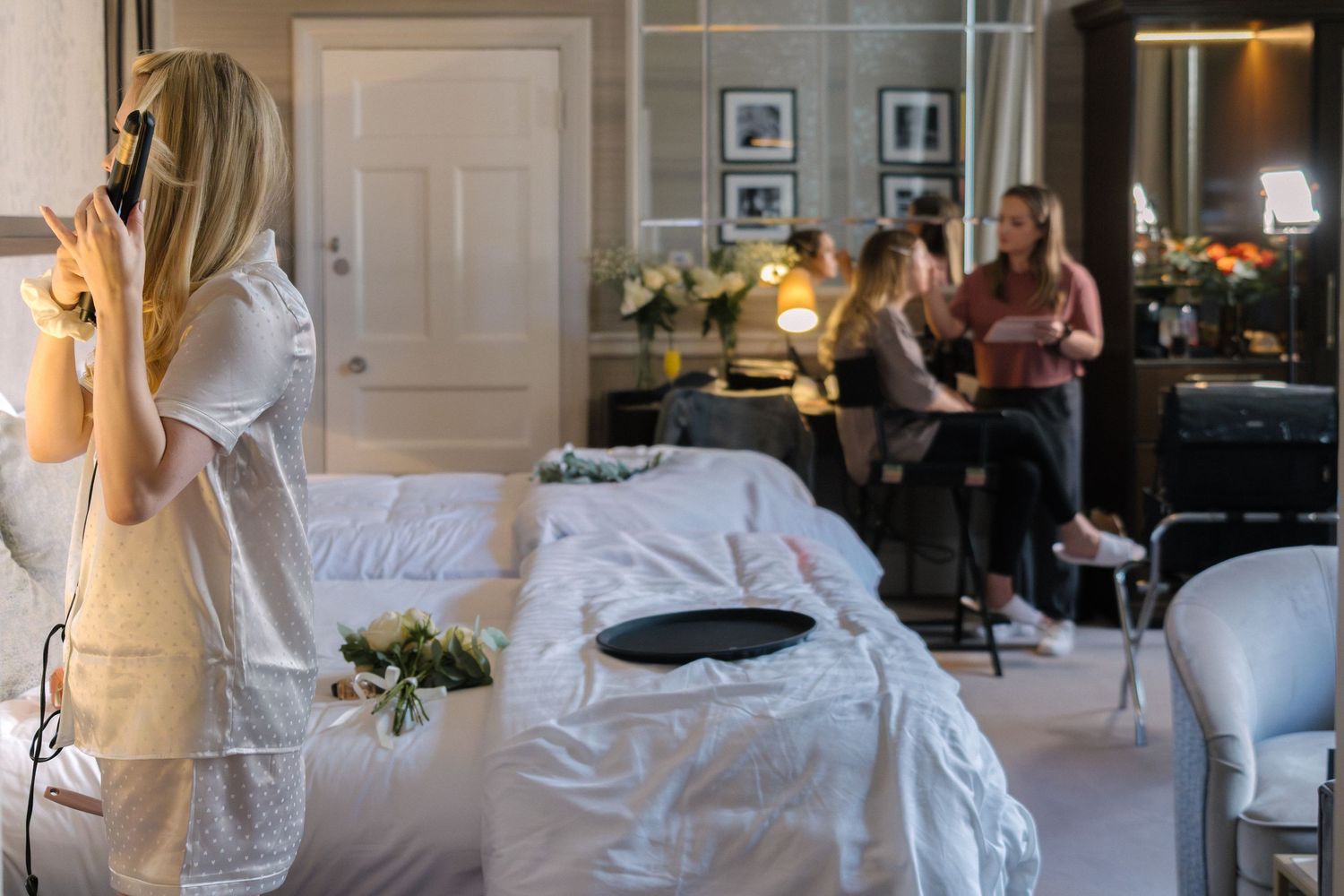 Elegant interior scene with white bedding and warm lighting creating a peaceful atmosphere.