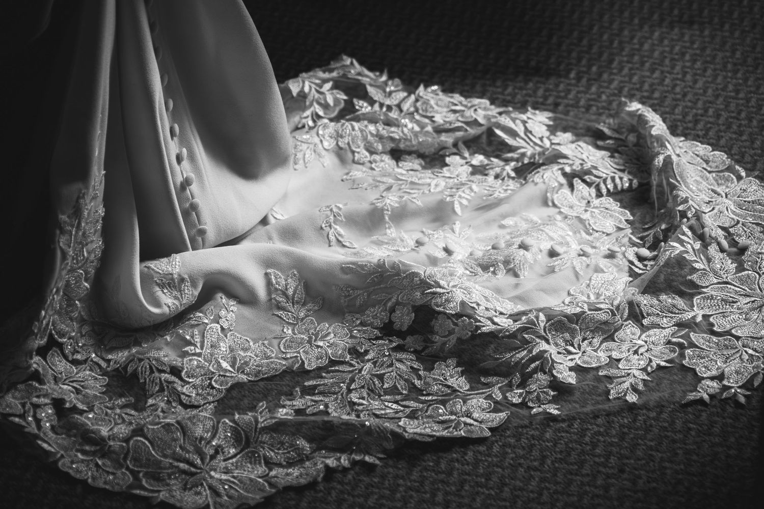 A black and white image sequence showing liquid splashing and flowing in dynamic patterns across a textured surface.
