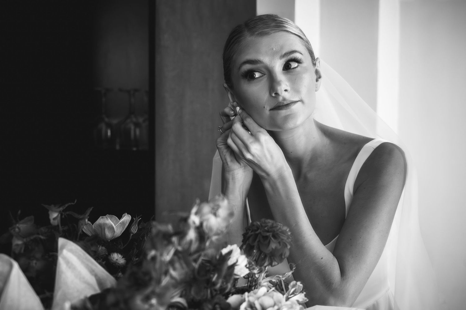 Black and white wedding photography series showing intimate bridal portraits and emotional moments.