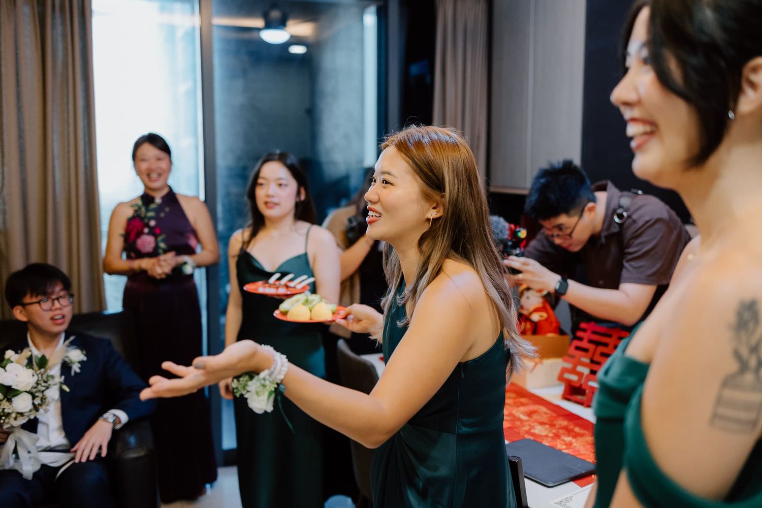 Wedding guests enjoying celebrations at an indoor reception venue.