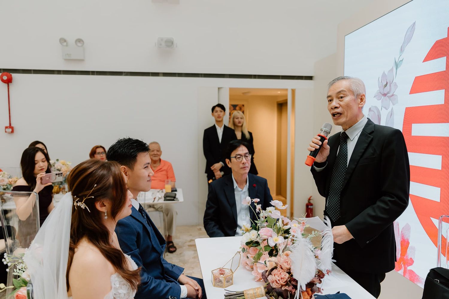 Wedding reception venue with contemporary decor and guests enjoying the celebration.