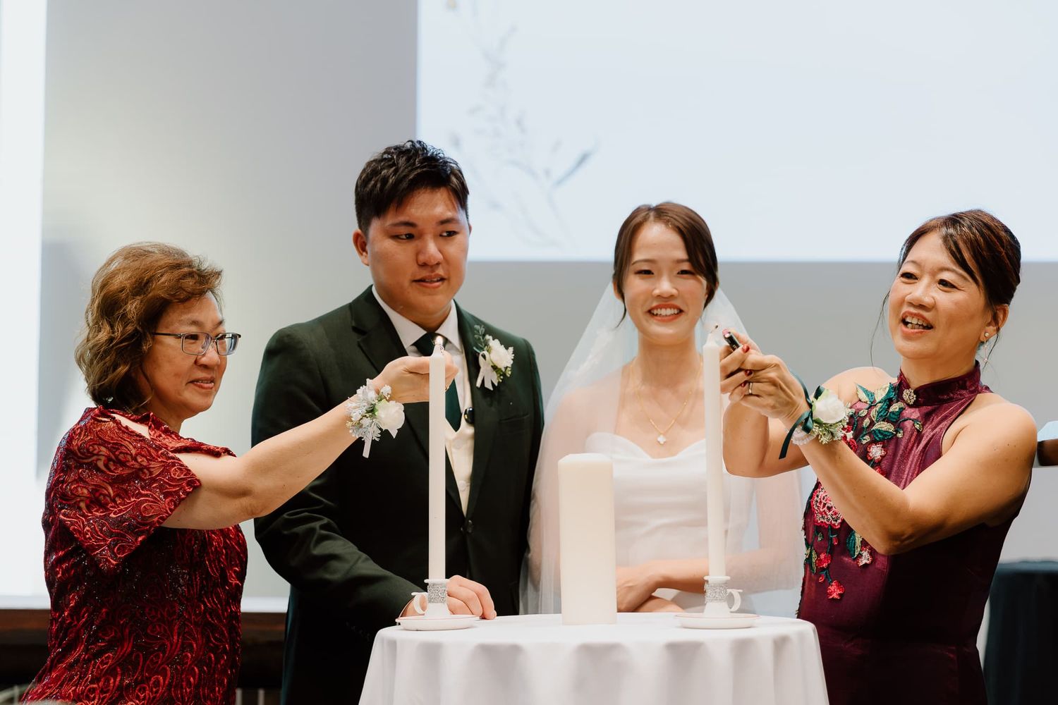 Wedding guests celebrate with joy during indoor ceremony reception.