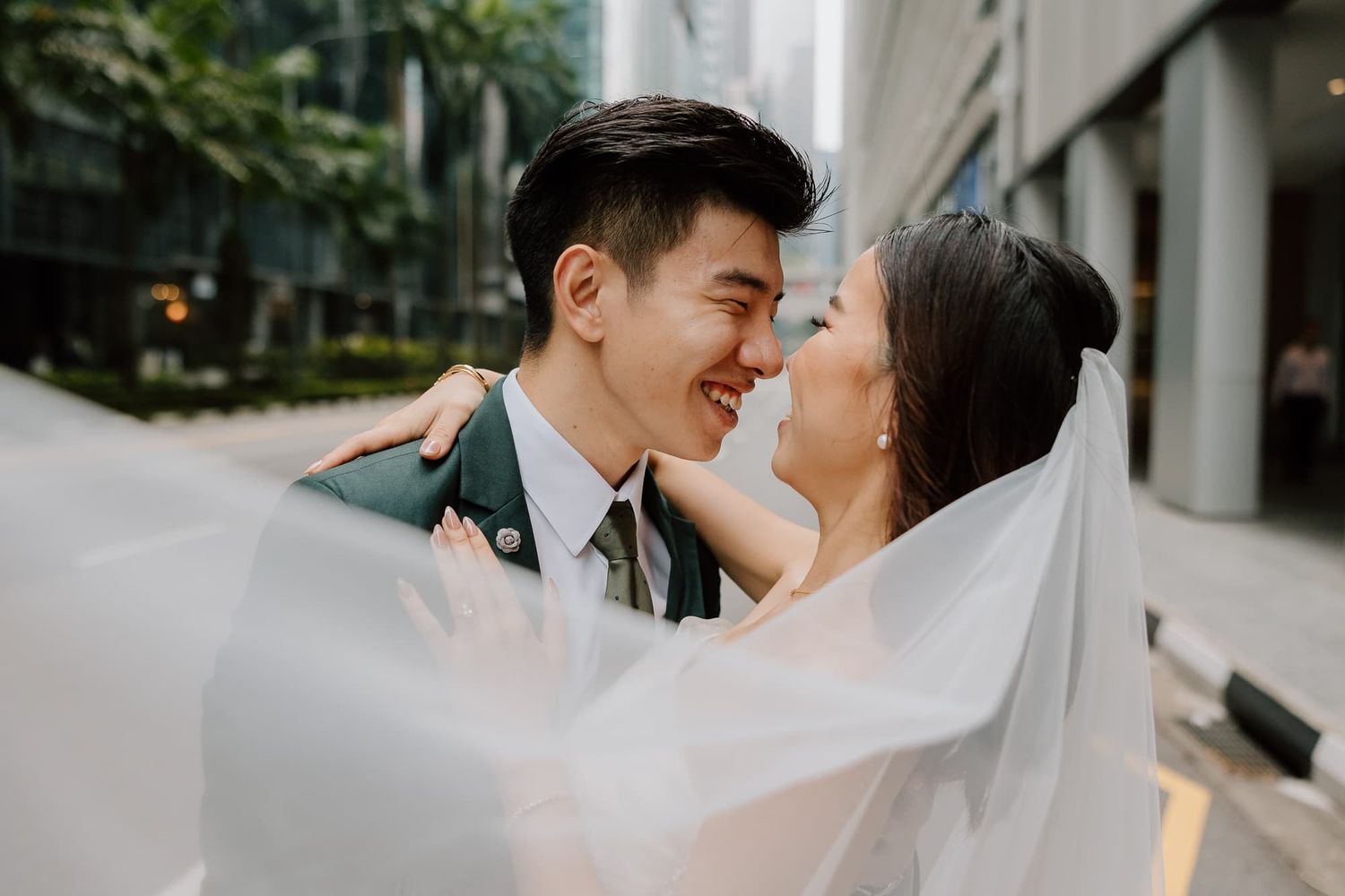 A romantic wedding photography sequence of intimate moments between a bride and groom set against a modern backdrop.