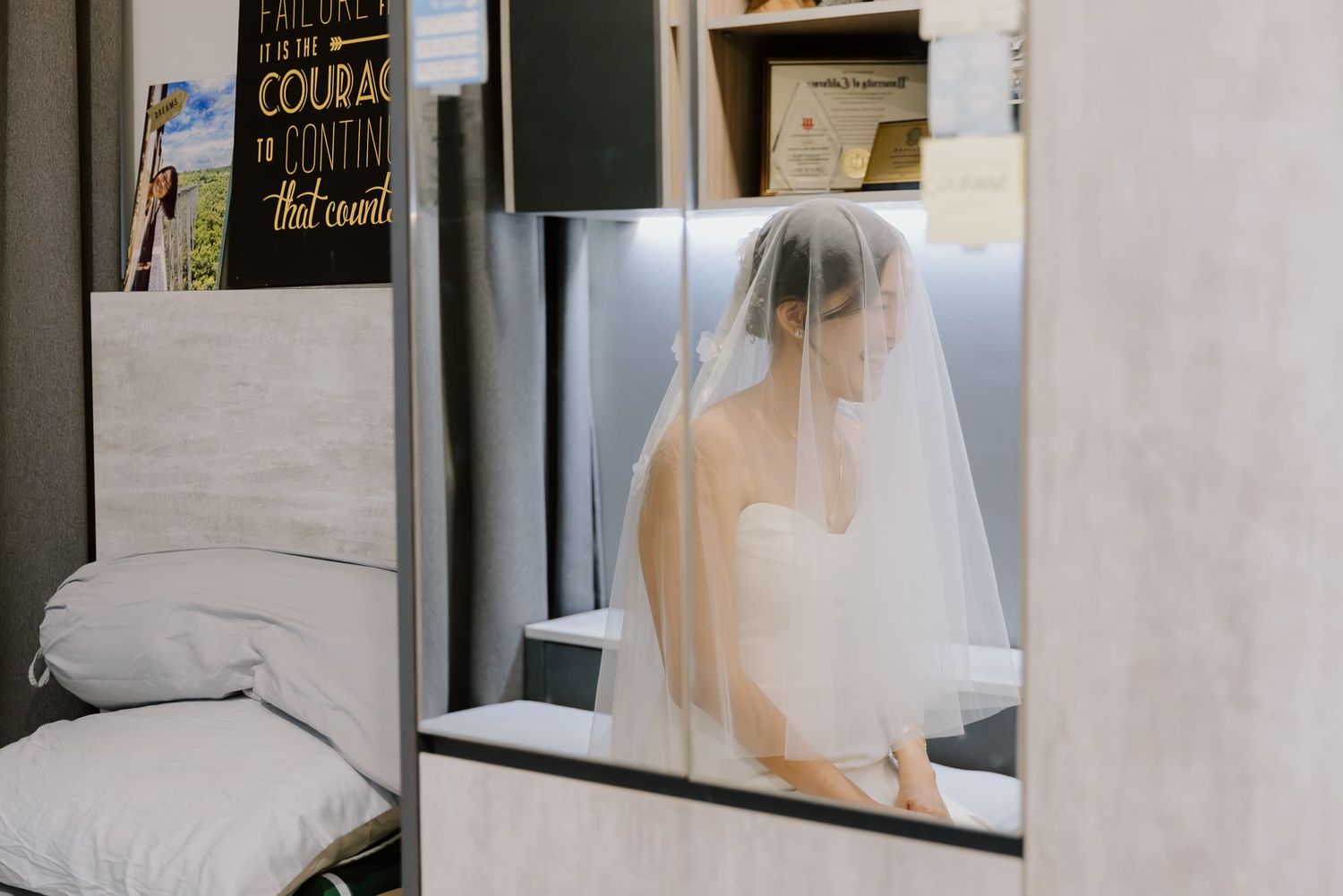 Modern minimalist wedding venue corridor with white walls and ambient lighting.