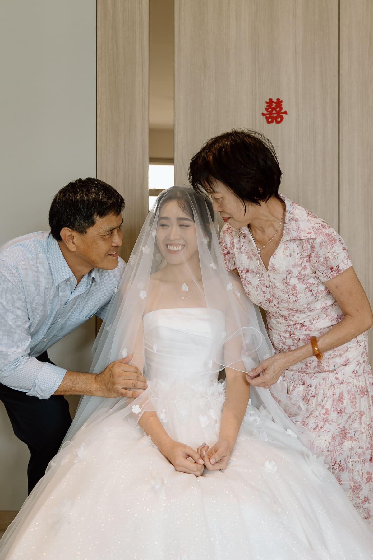 A series of candid wedding preparation moments showing tender interactions in a bright indoor setting.