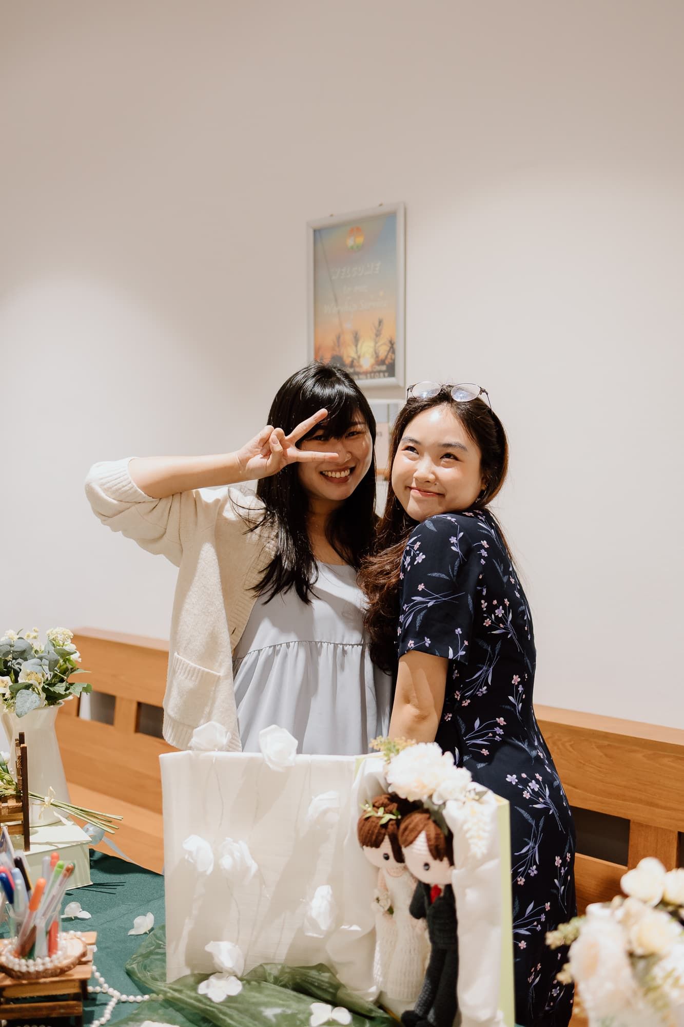 Wedding guests posing playfully at reception celebration.