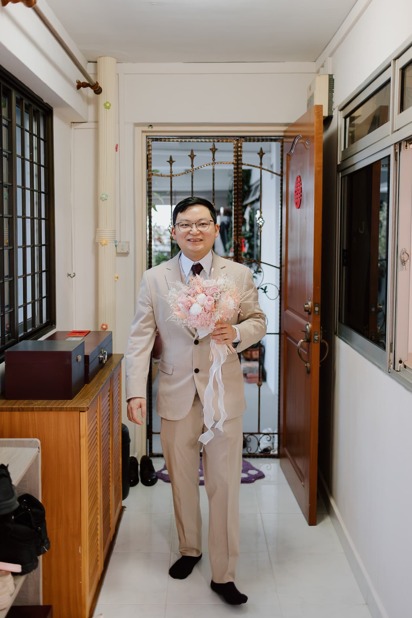 Interior hallway with traditional Asian decor featuring wedding preparations.