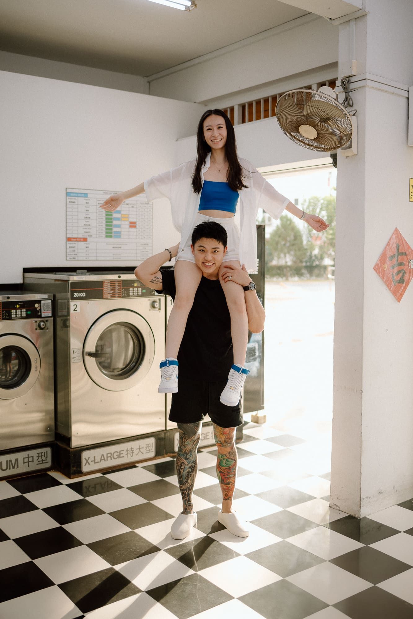 A playful sequence of someone dancing and posing in a laundromat with black and white checkered floors.