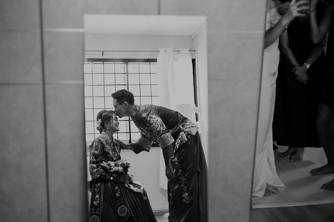 Black and white photo of traditional Chinese wedding ceremony preparations.