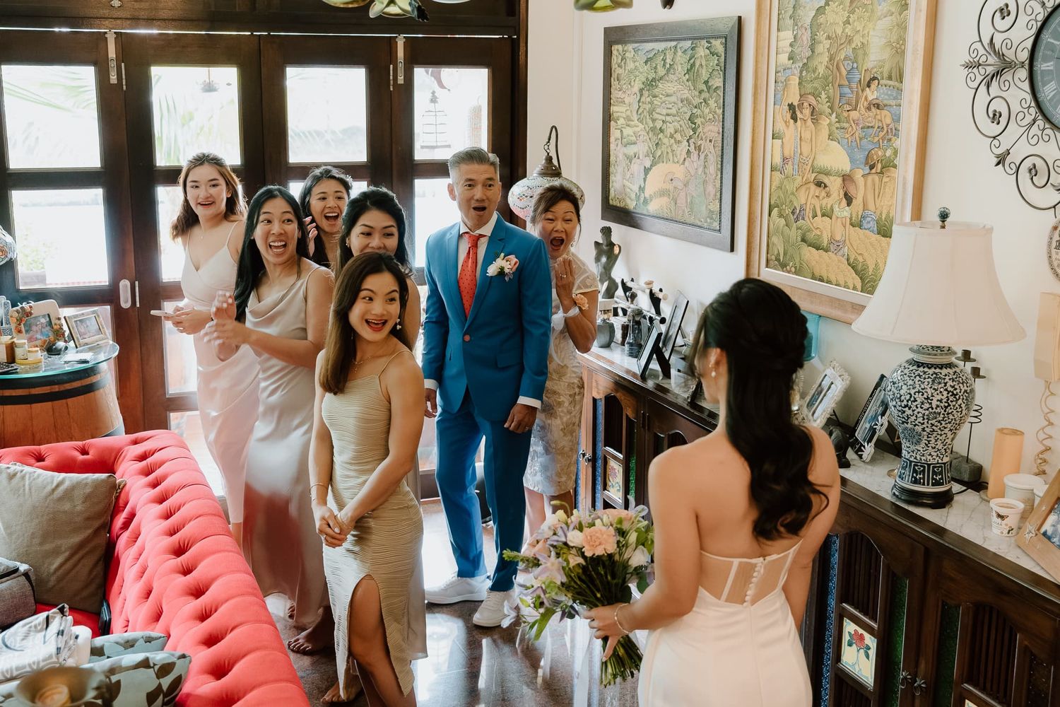 Guests gathering in an ornately decorated interior space during a celebration.