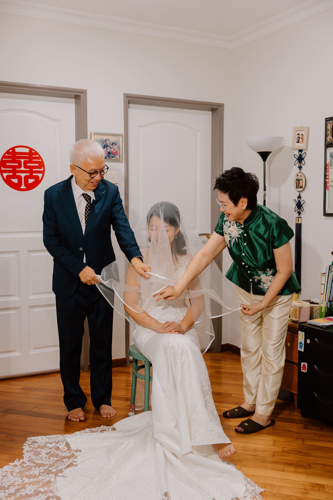 Five sequential photos showing a couple engaged in playful dance moves on a hardwood floor.