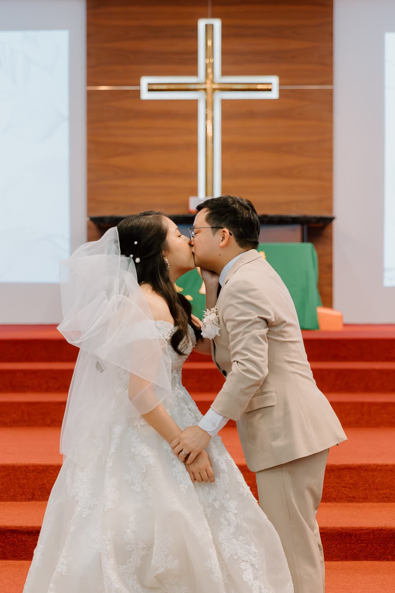 Wedding guests gather in a church lobby after the ceremony.
