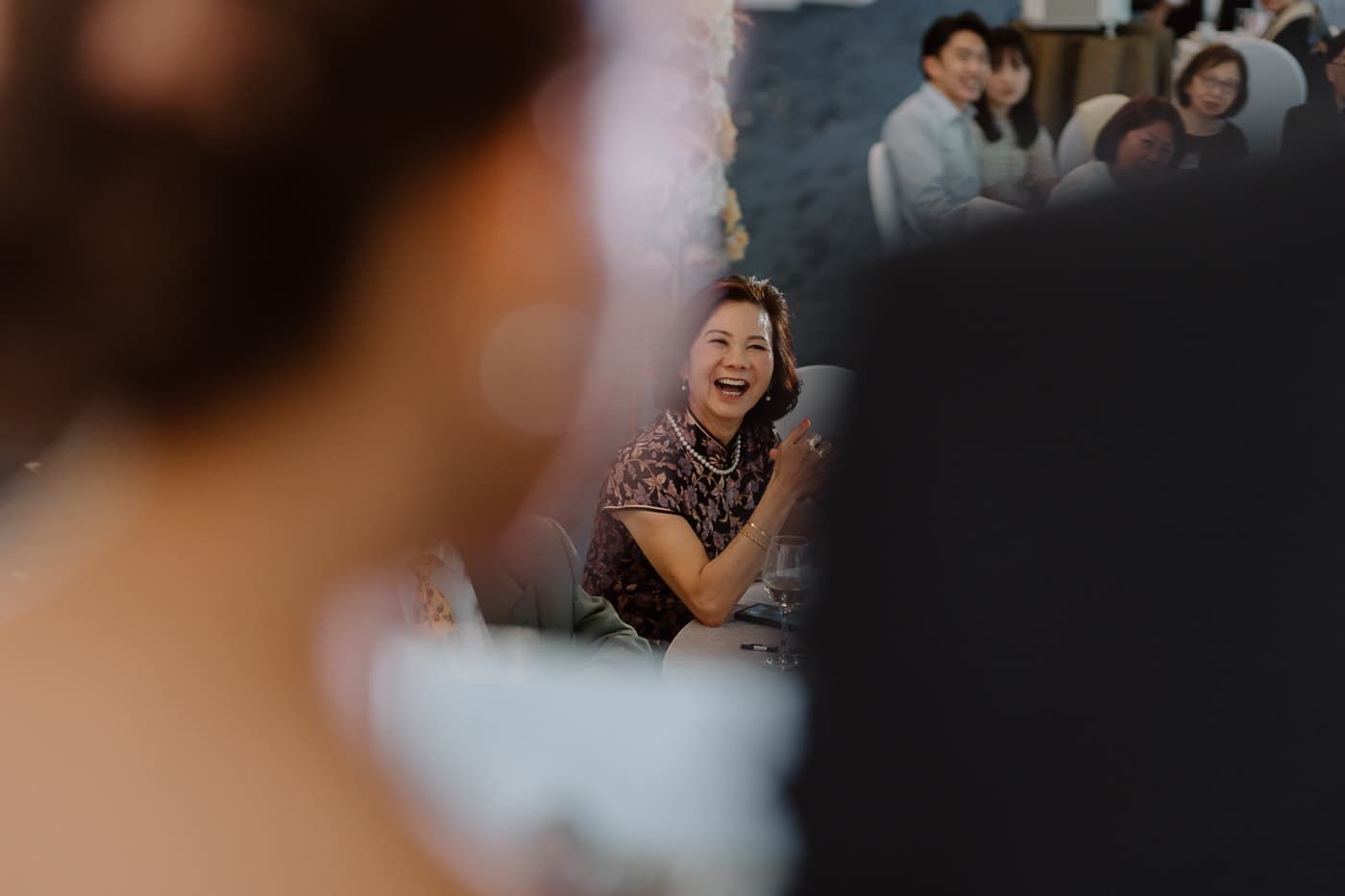 Joyful candid moments captured during a wedding celebration.