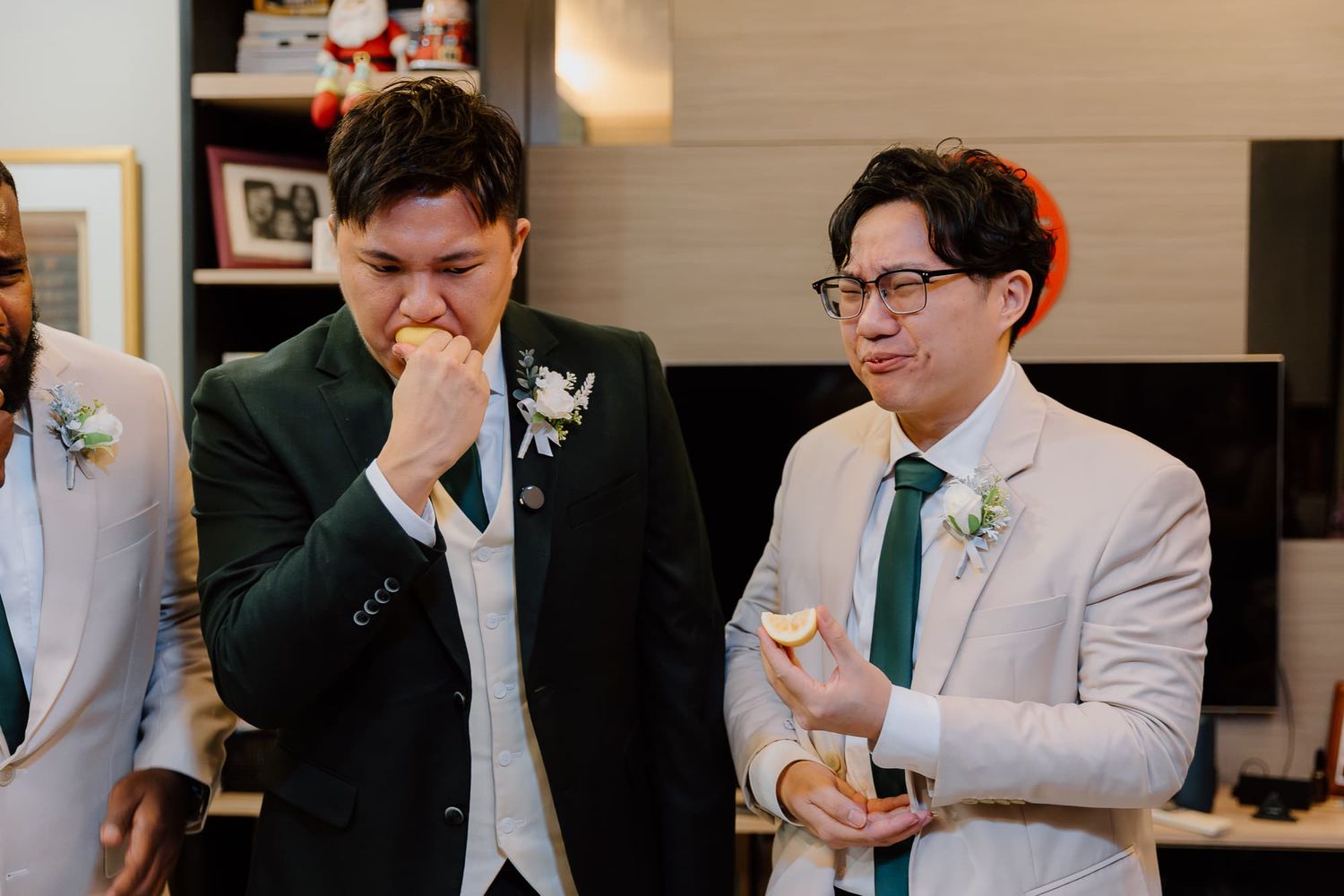 Wedding party members sharing emotional moments and laughing together inside.