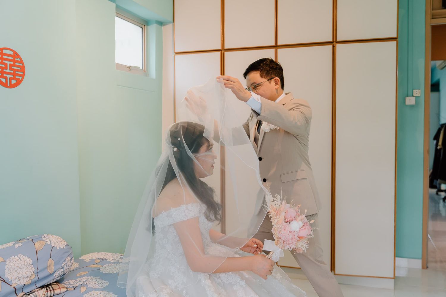 Modern room interior with traditional Asian design elements and wedding decorations.
