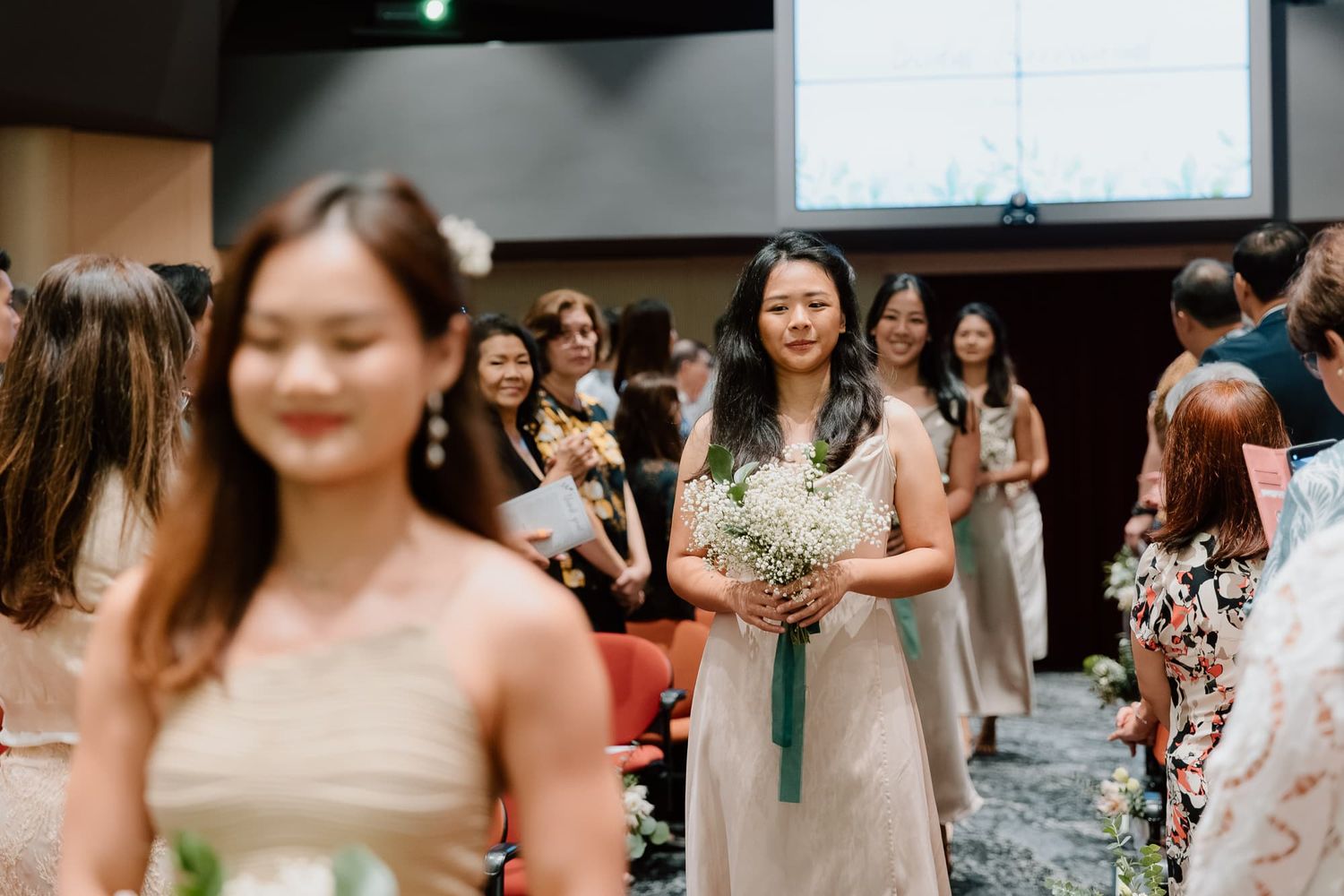 A celebration event with attendees in formal attire.