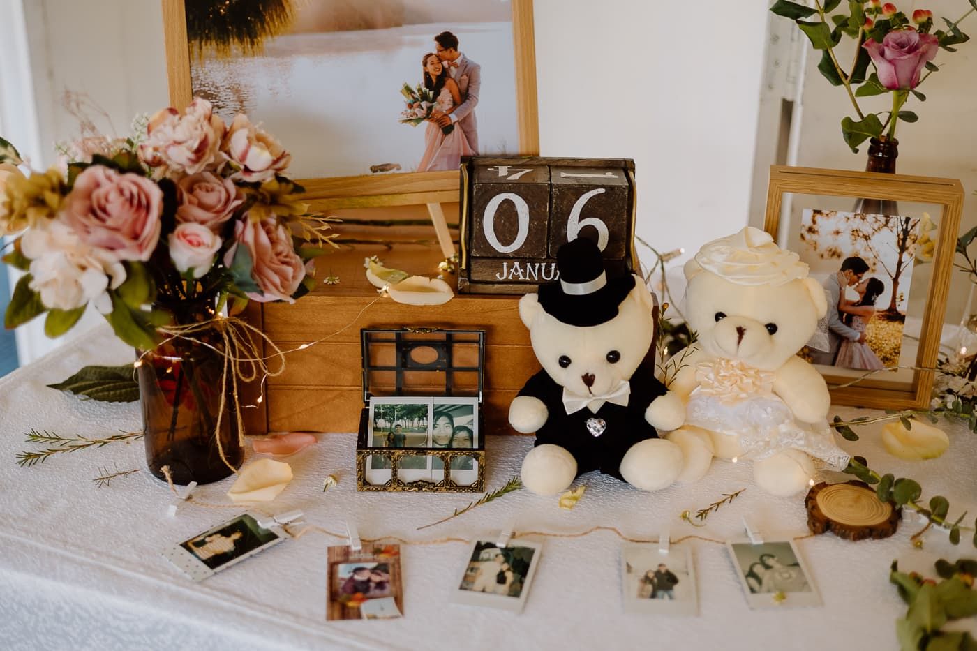 Wedding decor details featuring vintage accents, flowers, and frame displays.