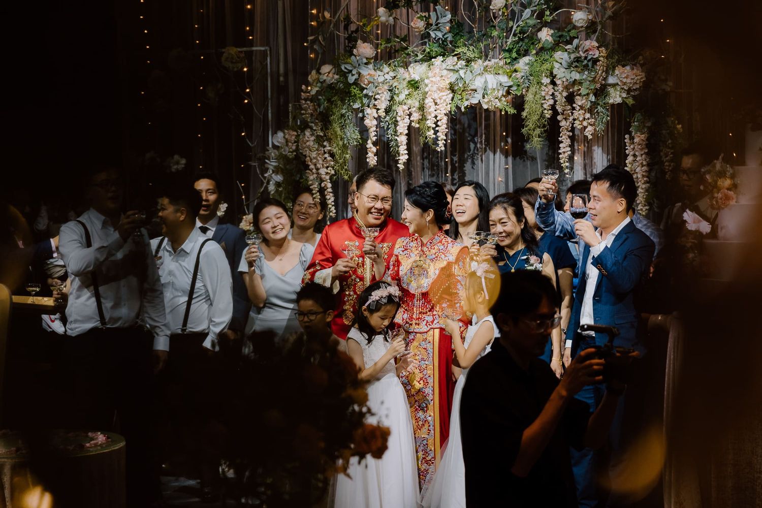 Six continuous dark moody wedding reception photos show couples and guests celebrating in an intimate venue setting.