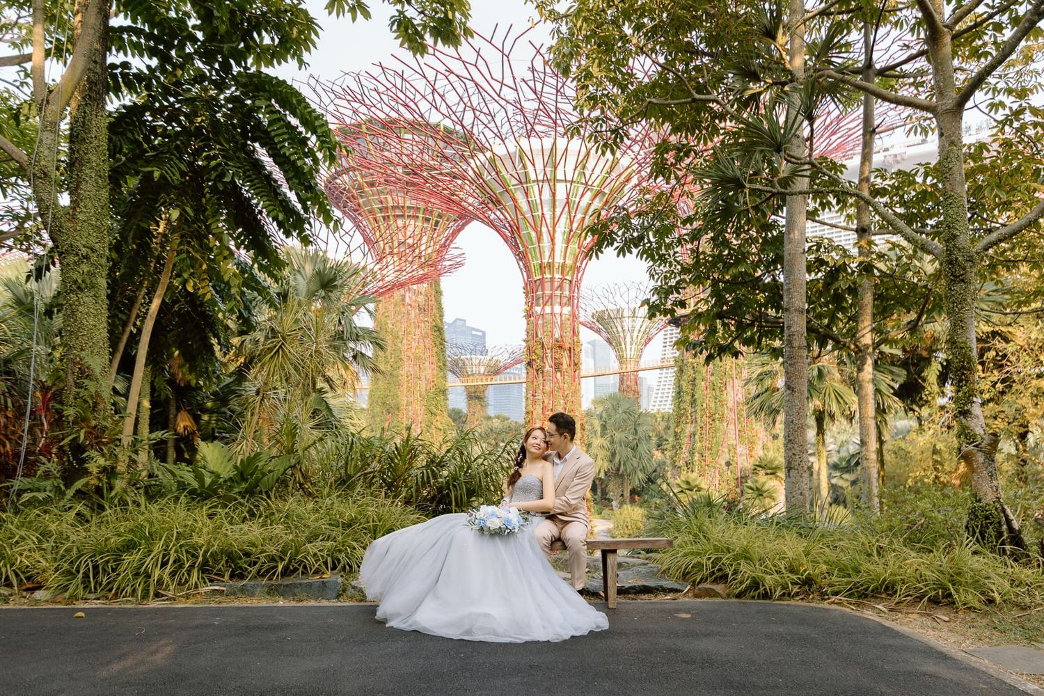 A dreamy wedding photo with the futuristic Supertree Grove structures in the background.