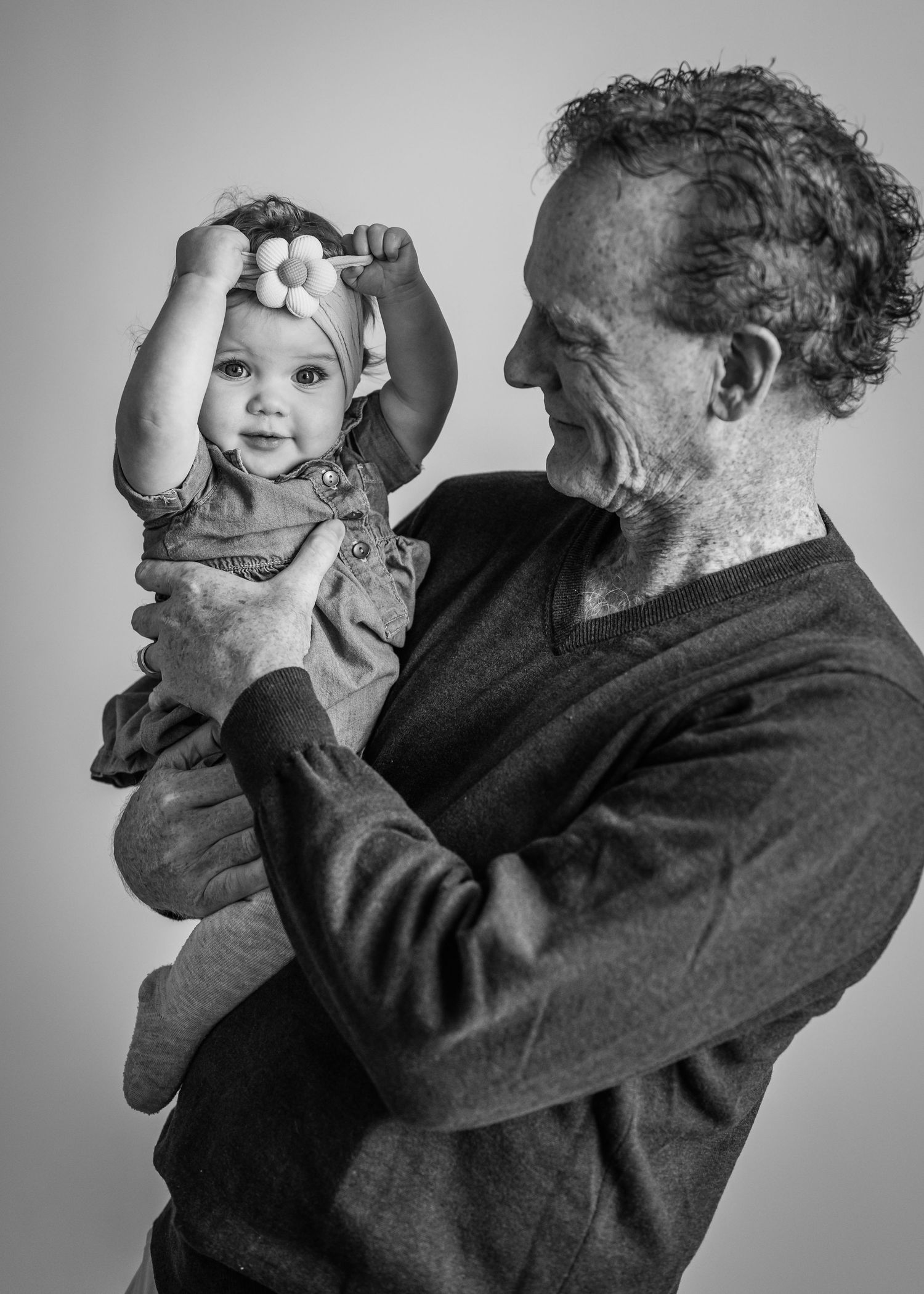 Black and white sequence showing tender moments of interaction in studio lighting.
