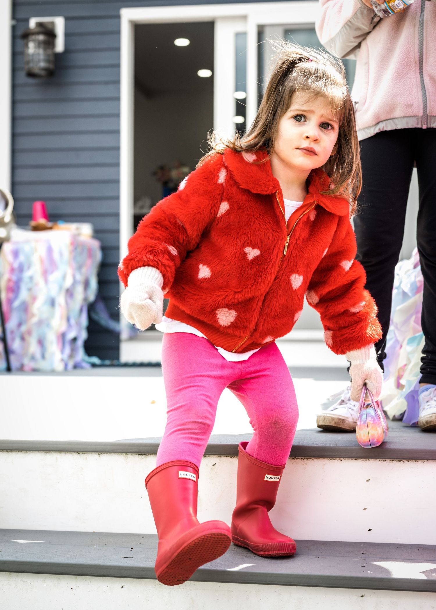 Birthday girl walking down the porch stairs