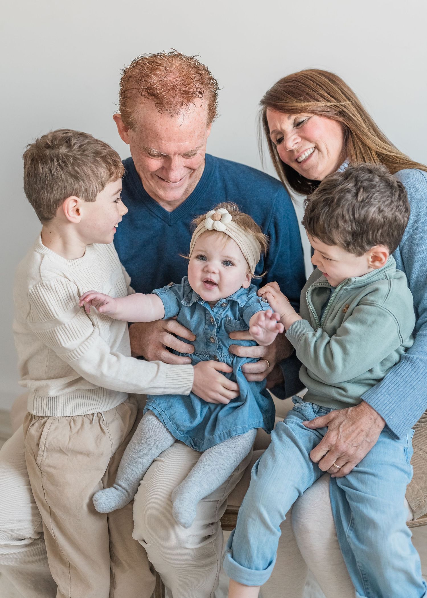 A playful family photo sequence showing joyful interaction and laughter against a white background.