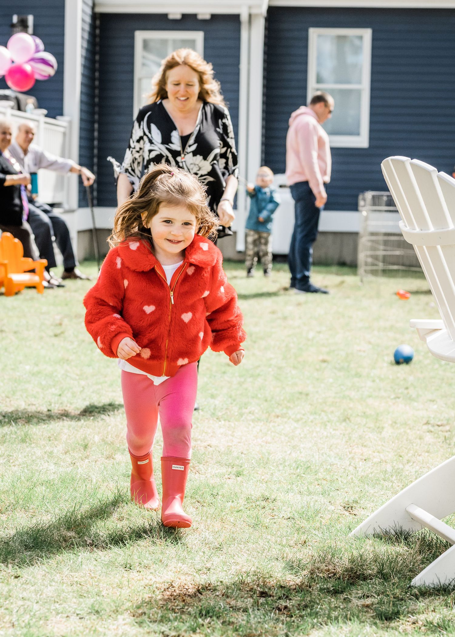 Birthday girl running from grandmother