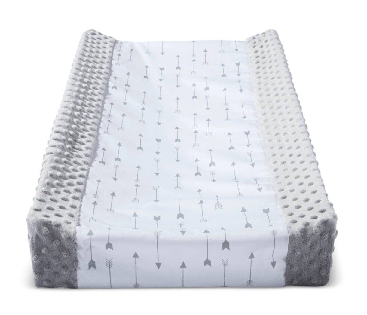 White changing pad with textured sides and arrow pattern featuring soft minky fabric for baby comfort.