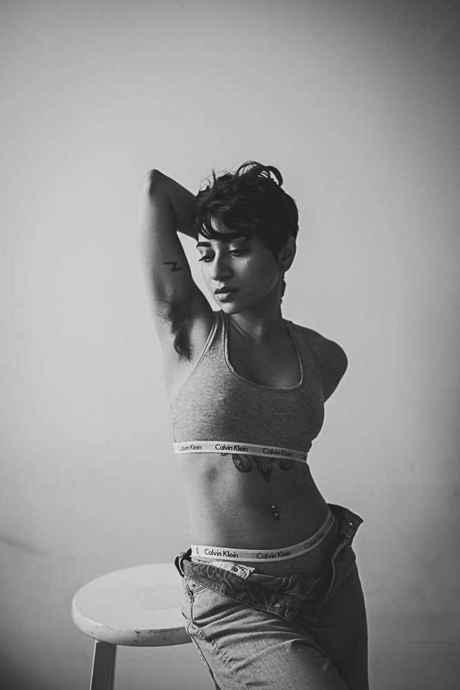 Black and white photo sequence of person in athletic wear posing against light background.