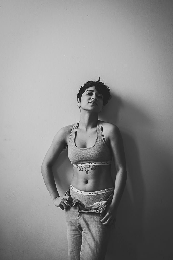 Monochrome fashion portraits featuring athletic wear and expressive poses in minimalist studio setting.