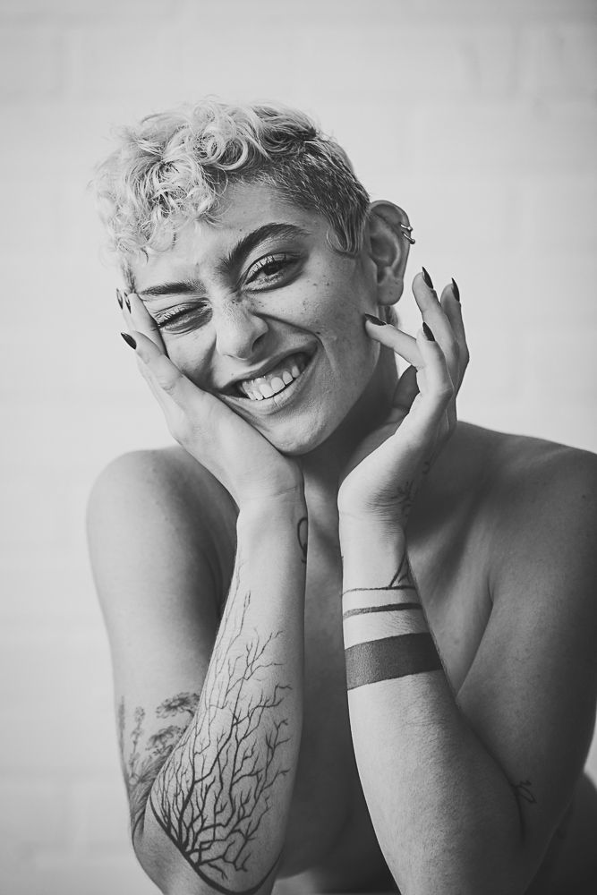 Black and white artistic portrait sequence showing joyful expressions and natural emotions in studio lighting.