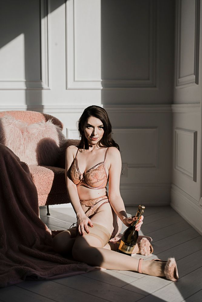 Artistic boudoir photography series showing intimate moments in soft natural window light against white walls.