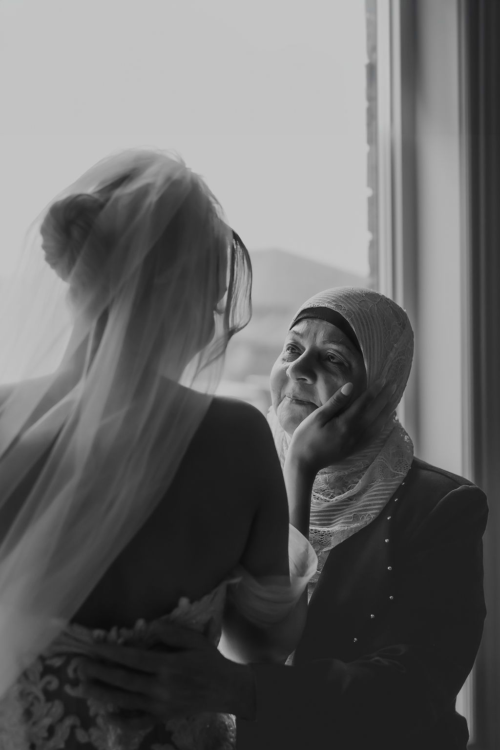 Artistic black and white photo through sheer fabric creating a dreamy effect.