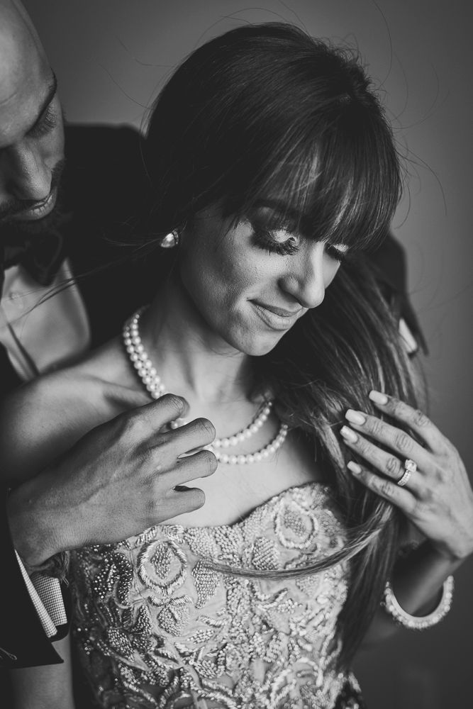 A series of artistic black and white portraits showing elegant details of lace and pearls in dramatic lighting.