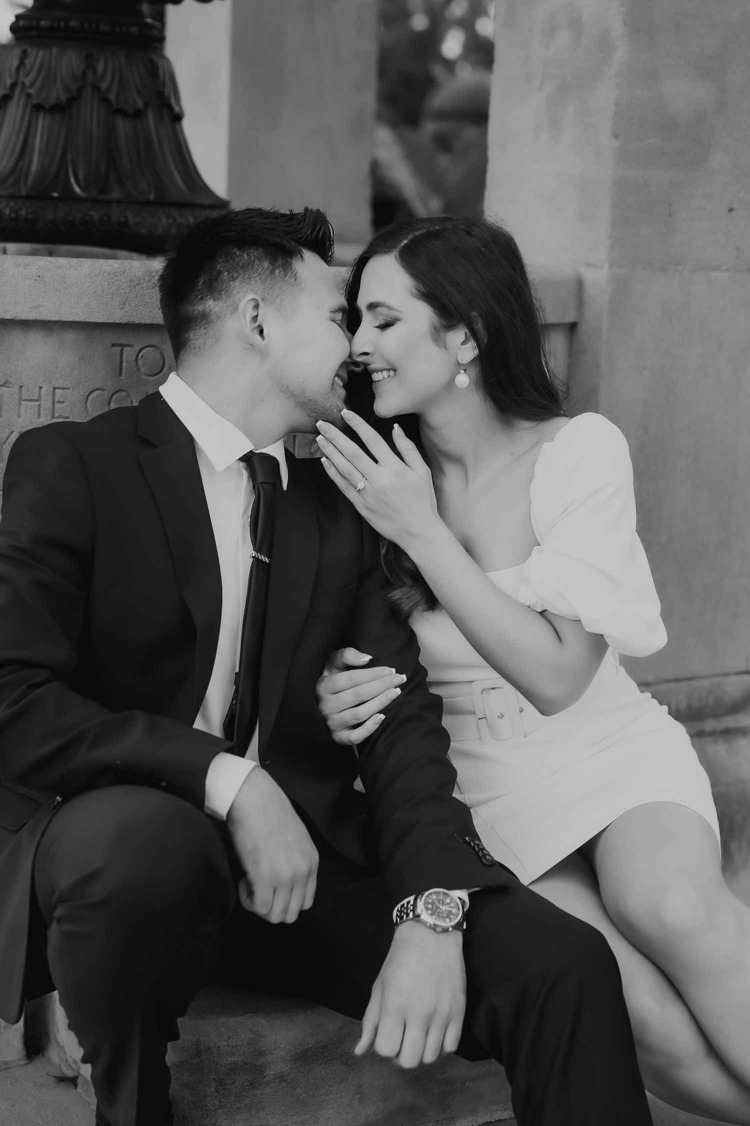 Romantic black and white photo series showing intimate moments between a couple sharing tender kisses.