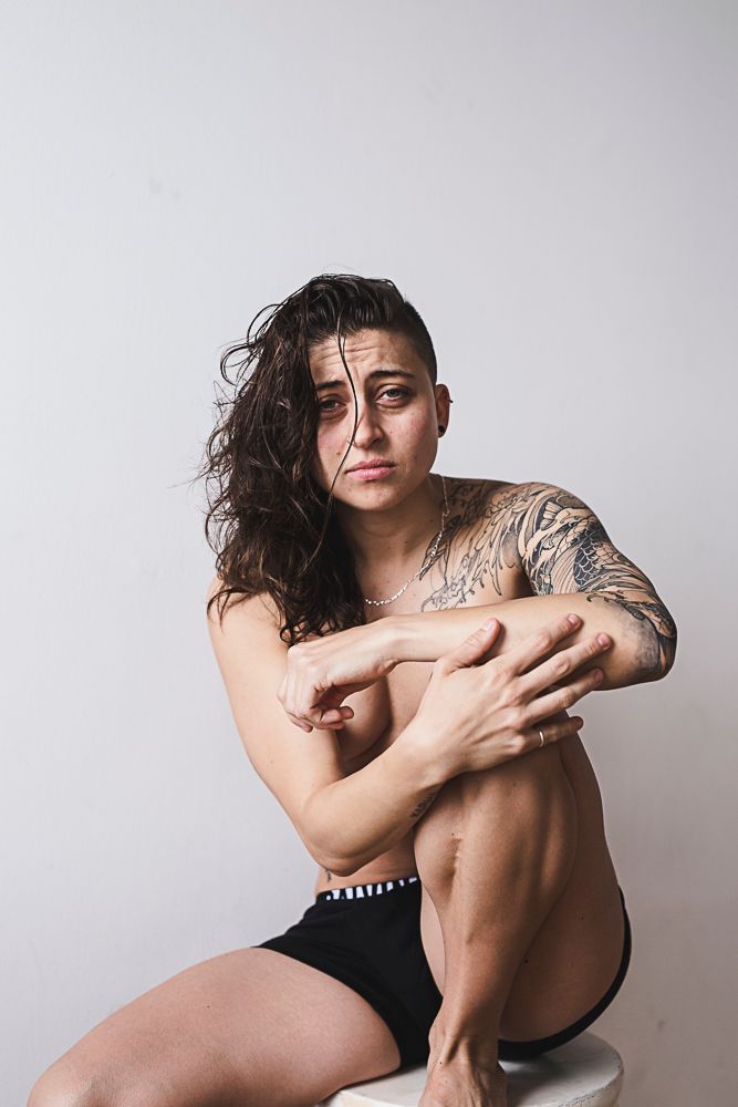 Artistic portrait series showing a figure in black against white background posing in minimalist style.
