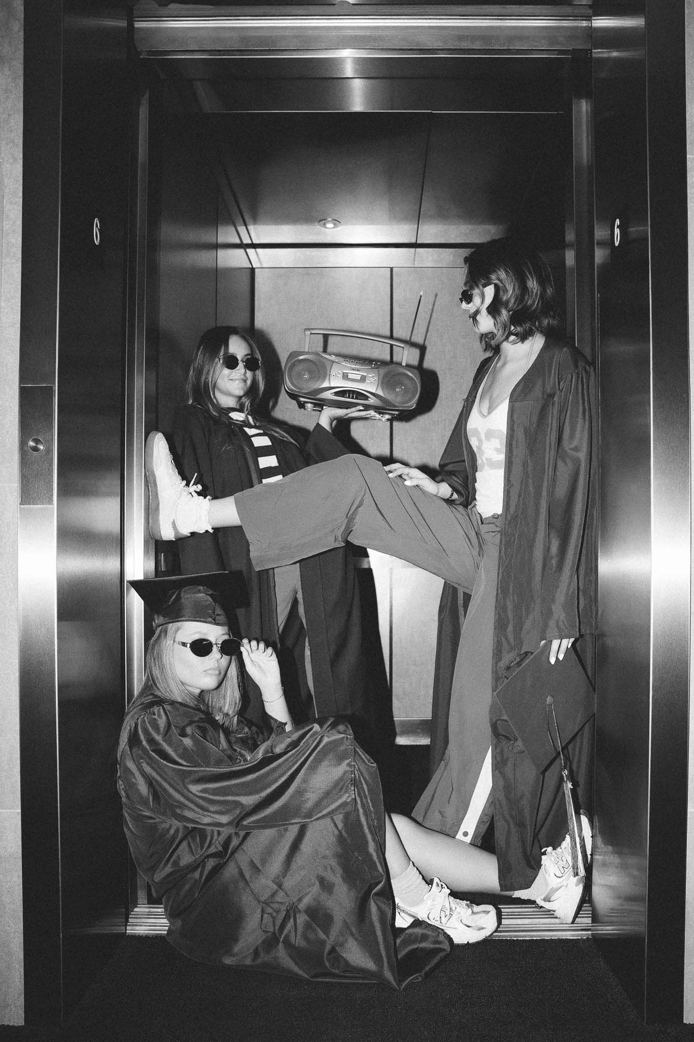 Black and white photo series showing figures in dramatic poses against elevator walls, creating an artistic composition.