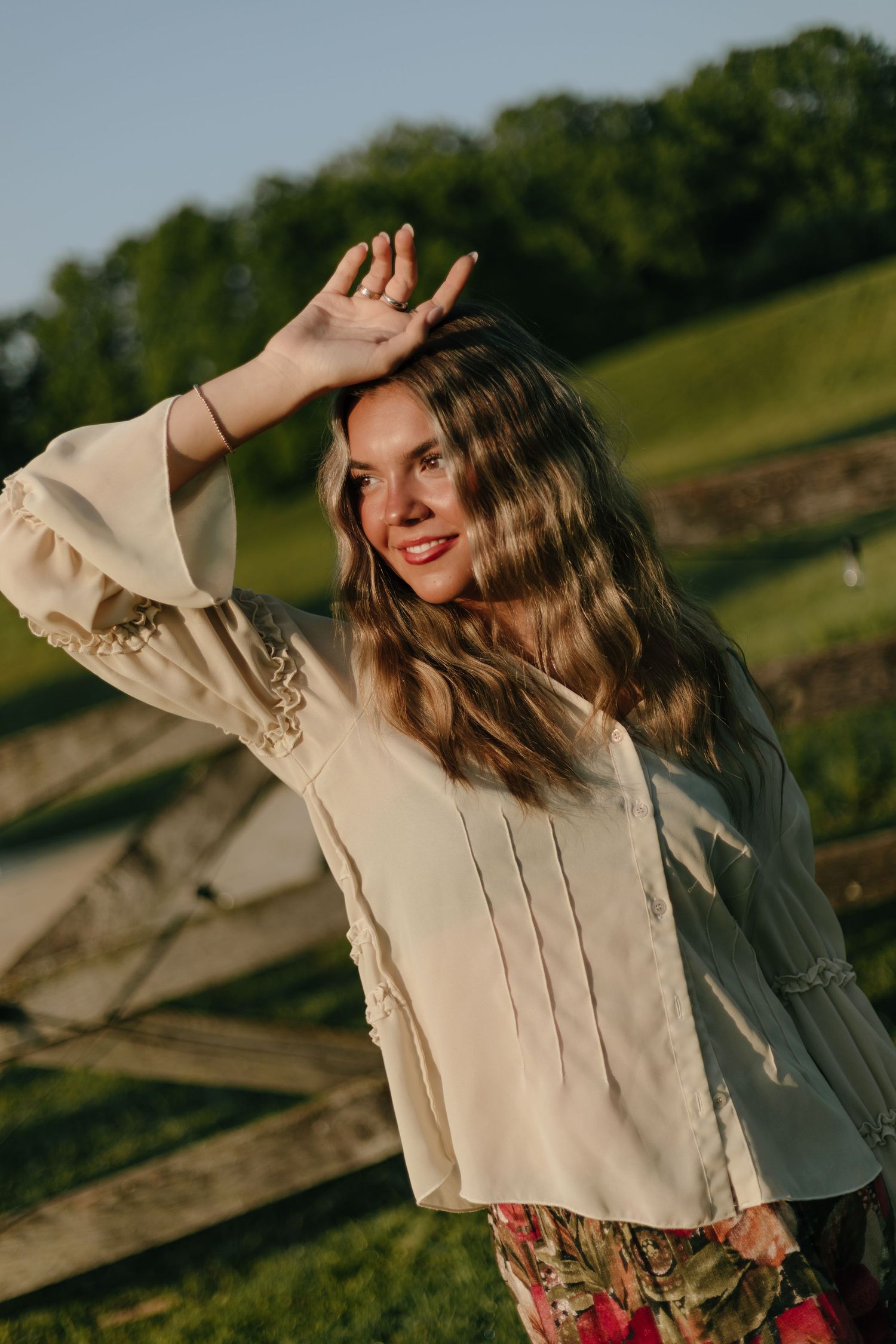 Artistic outdoor photo sequence with vintage-style clothing against a sunset backdrop.