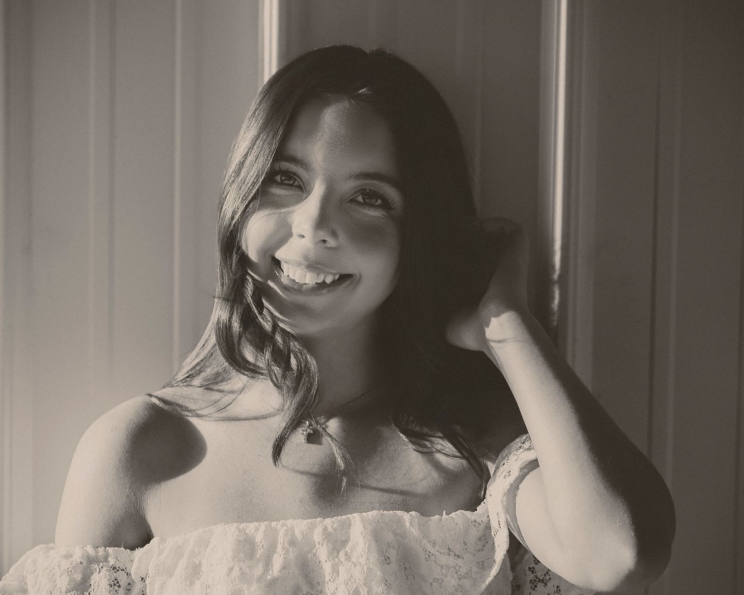 Monochrome portrait series with natural window lighting and expressive poses.