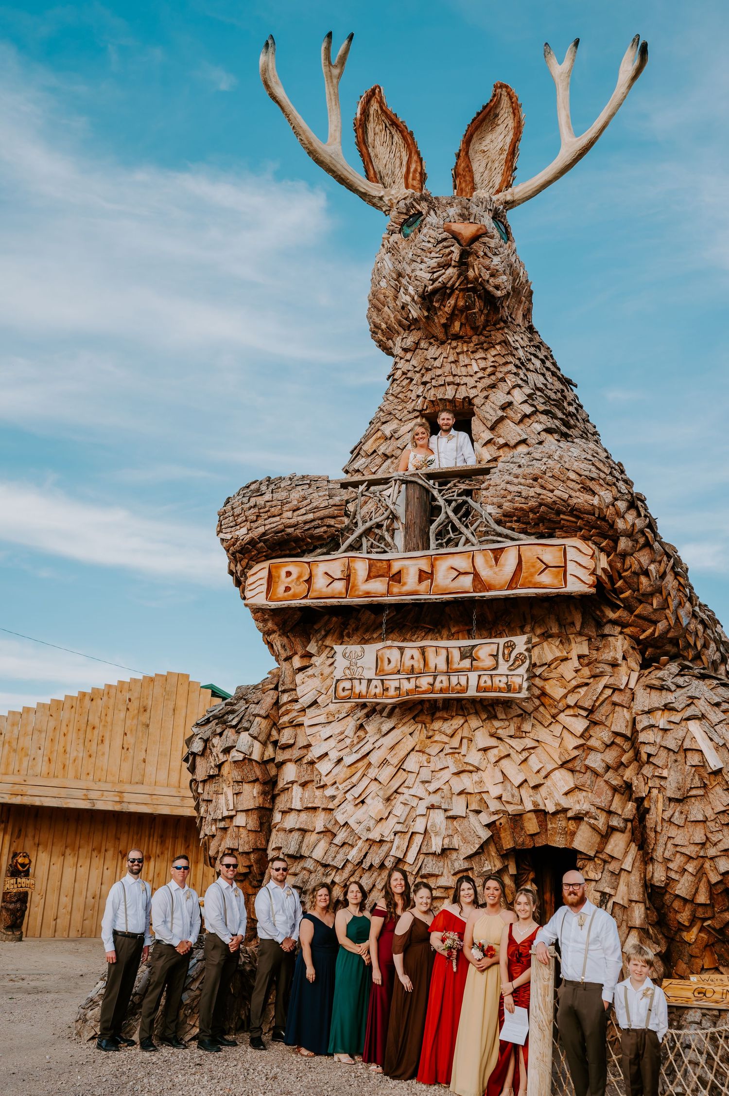 A sequence of photos showing a rustic stone archway with a 'BELIEVE' sign at an outdoor wedding venue with gathering guests.