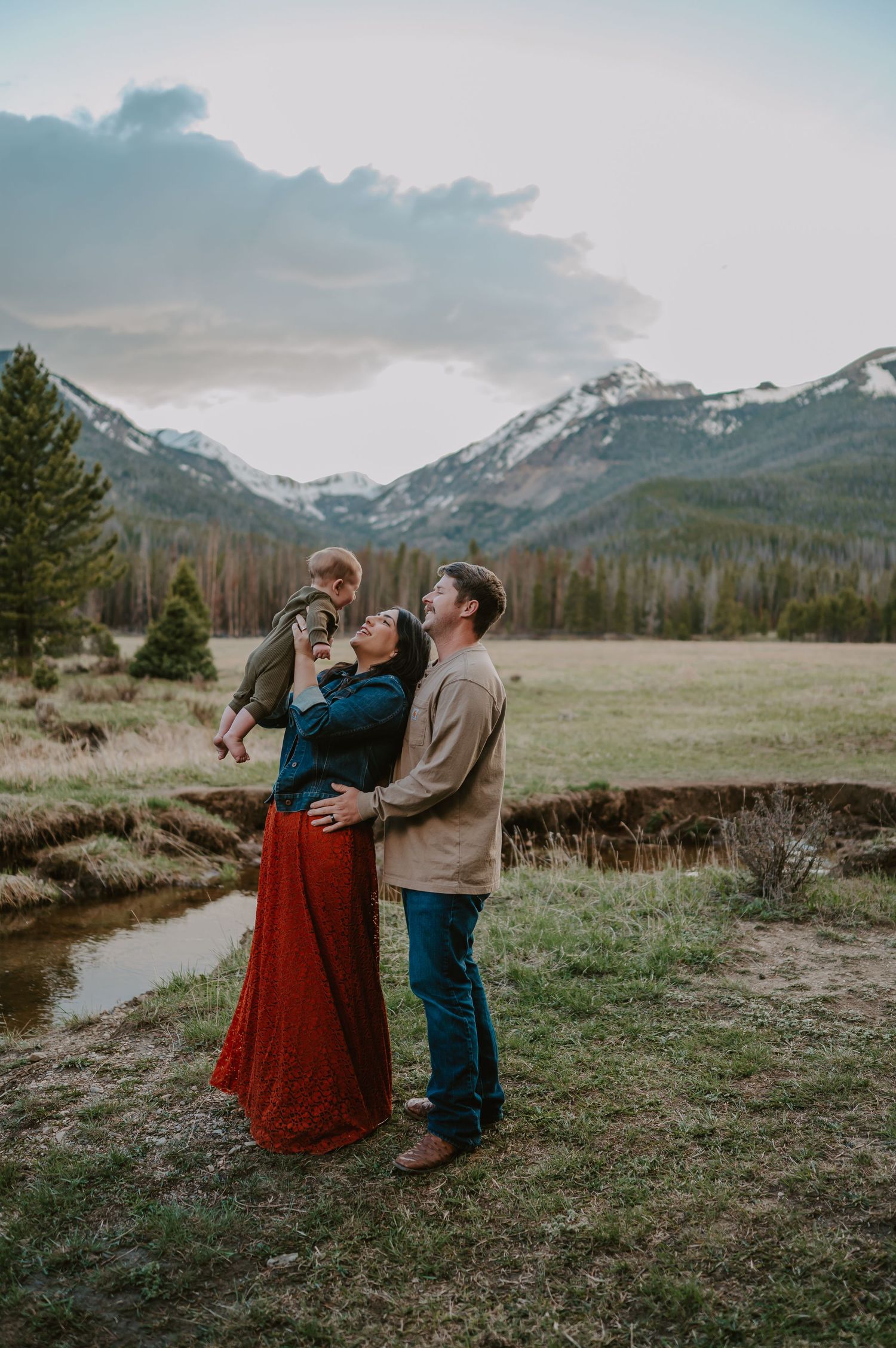 A family in Rocky Mountain National Park at Sunset