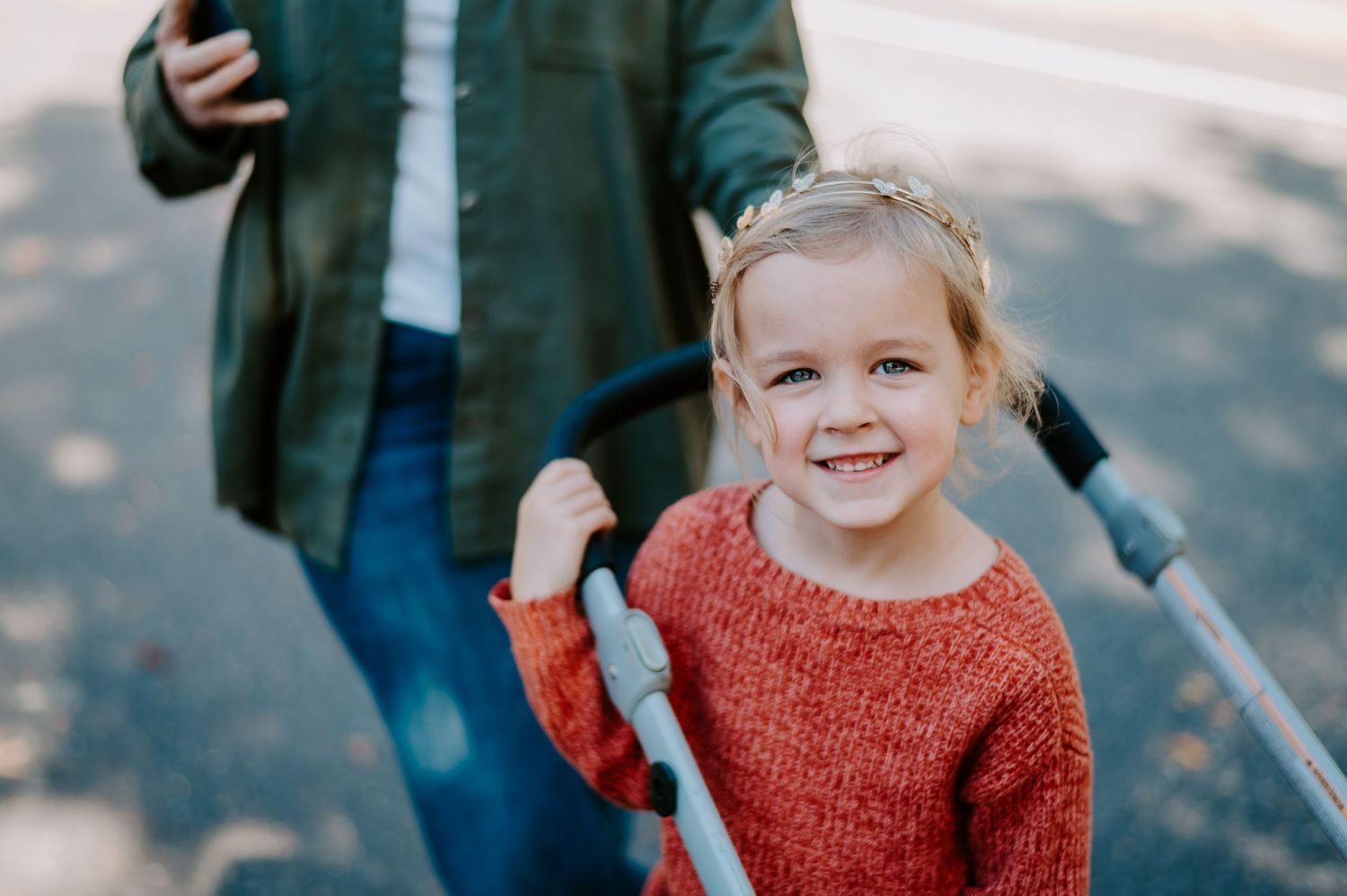 A child at the zoo smiling