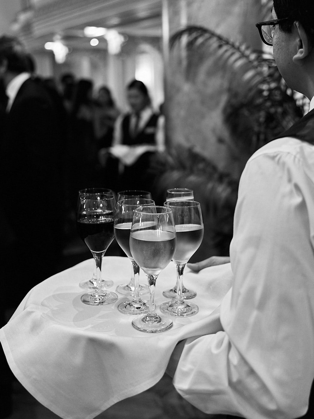 Wedding guests captured candidly at a Riga celebration