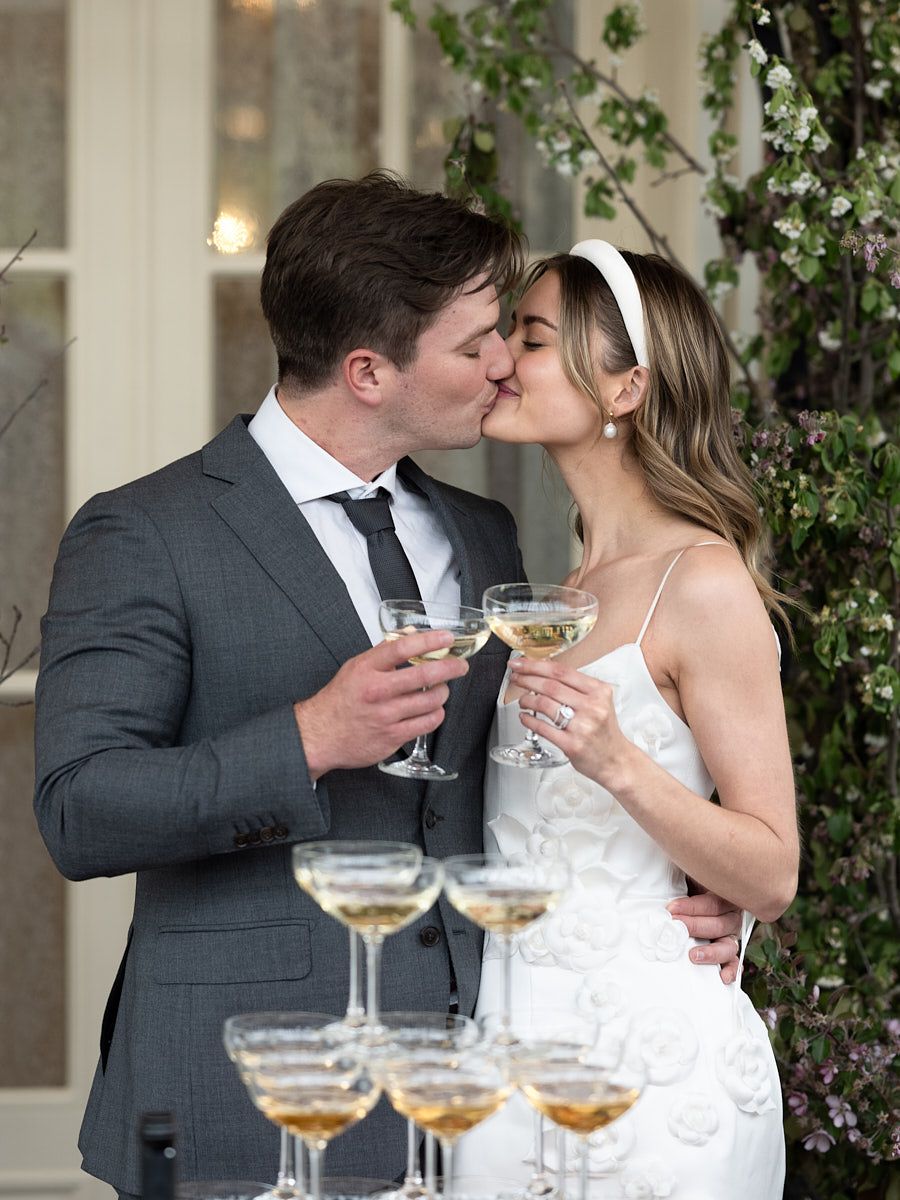 Champagne tower celebration during elegant Riga wedding