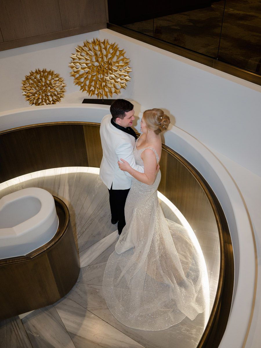 Bride and groom celebrating their wedding reception at JW Marriott Riga, surrounded by love and elegance.