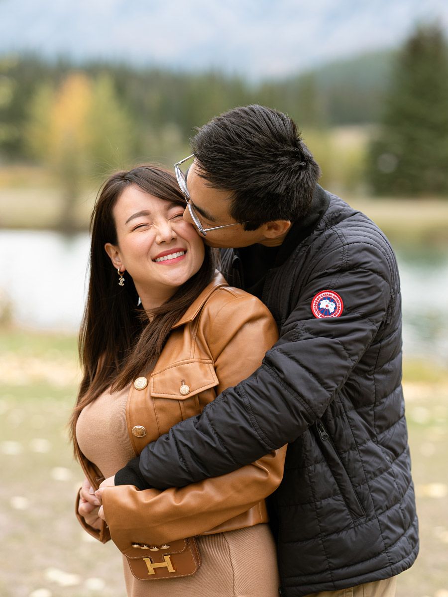 Engaged couple embracing in Baltic nature, romantic engagement session near Riga