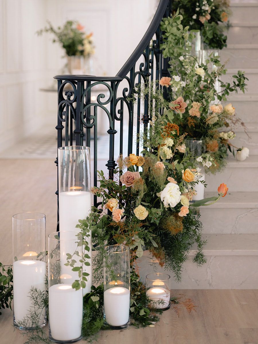 Romantic Riga wedding staircase decorated with floral arrangements, perfect for couple portraits