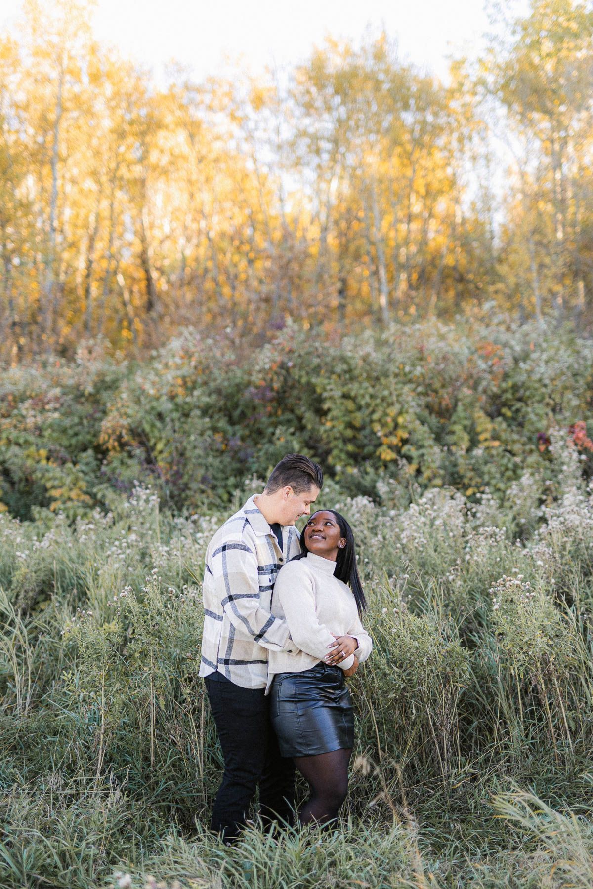 Candid and heartfelt engagement session in Riga, showcasing authentic moments between a couple.
